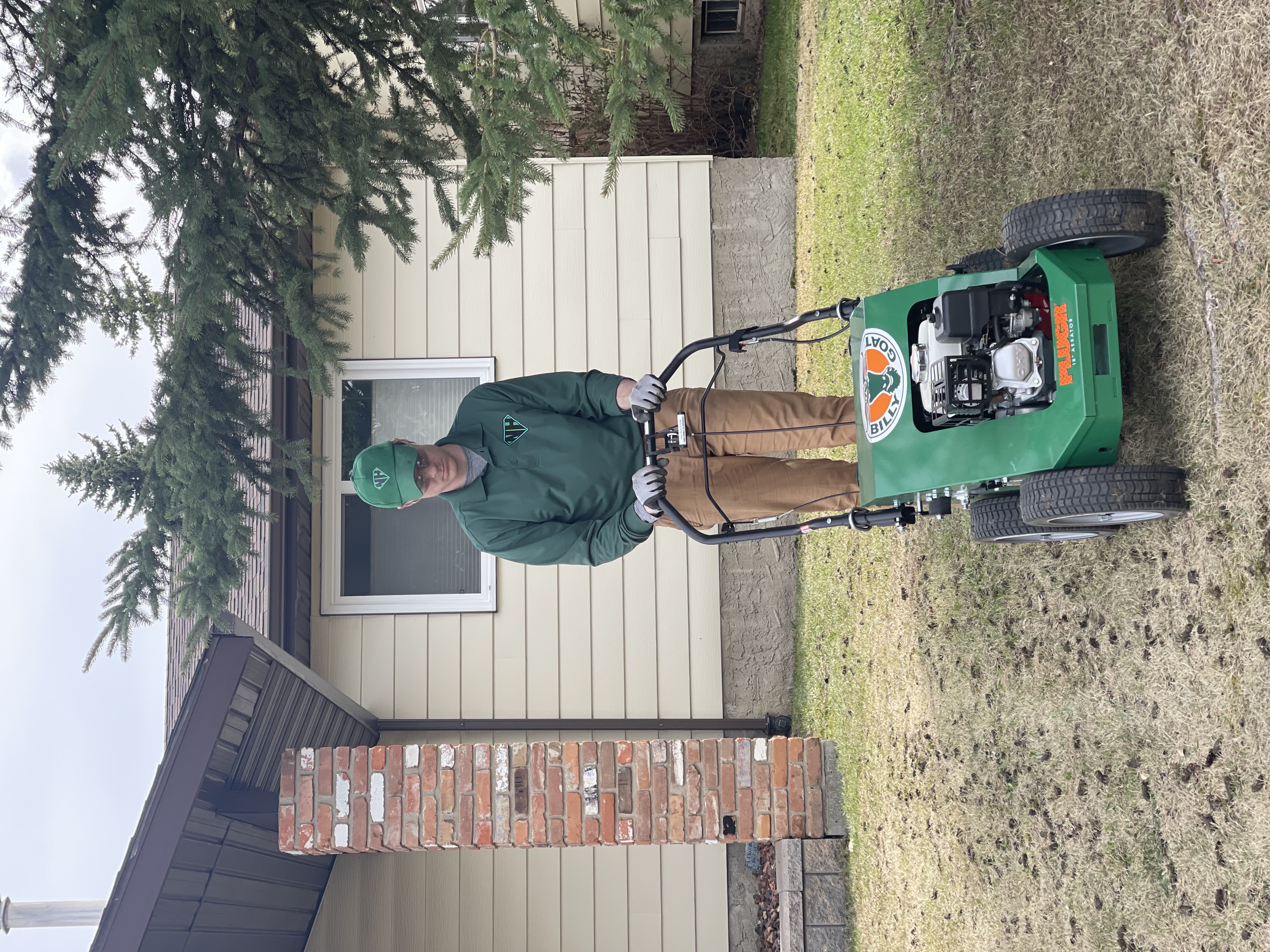 Neighbourhood Heroes performing an Aeration in windermere edmonton